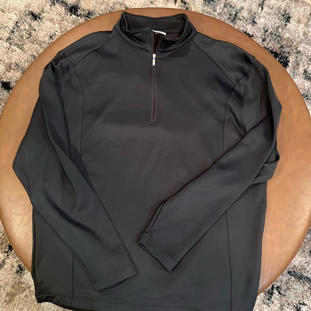 Nike golf pullover green in color.